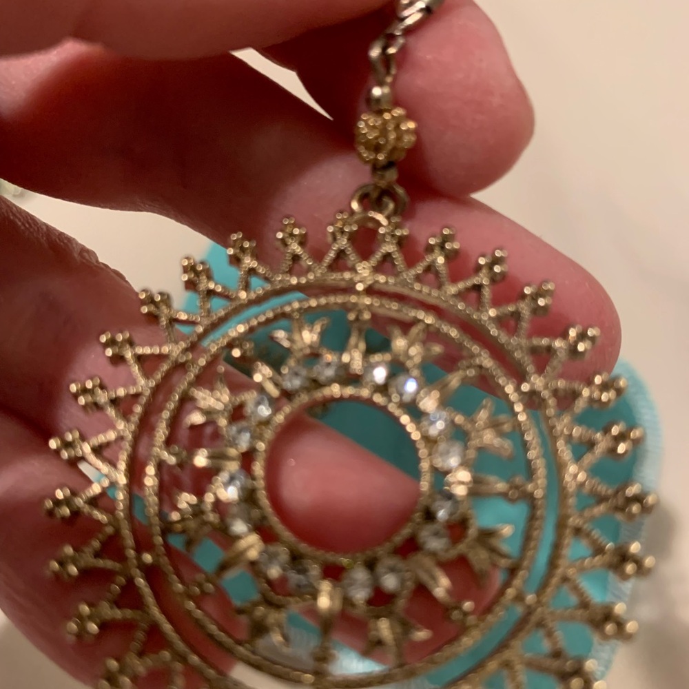 Beautiful gently worn fashionable golden color  earrings with crystals.Must have